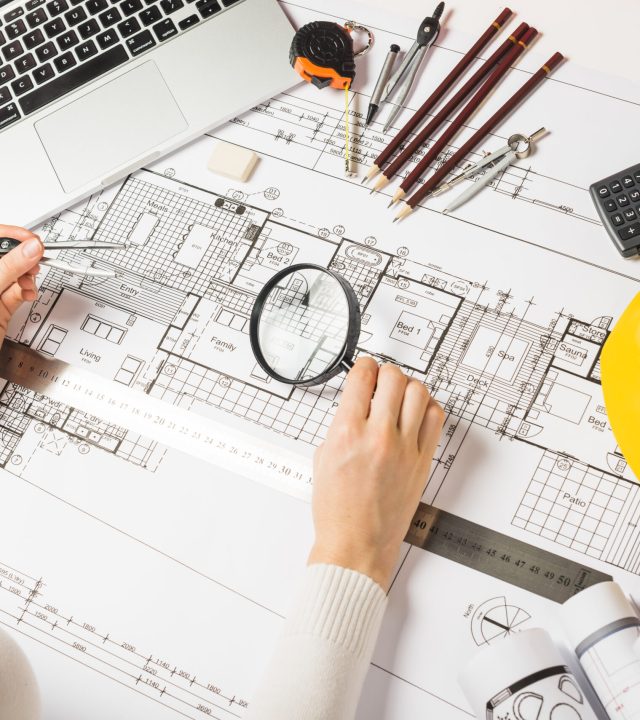 architect-making-plan-with-loupe